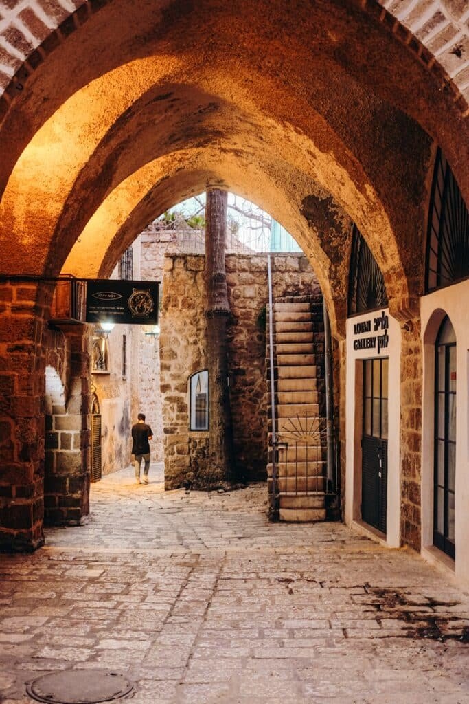 brown brick building with brown wooden door Jaffa